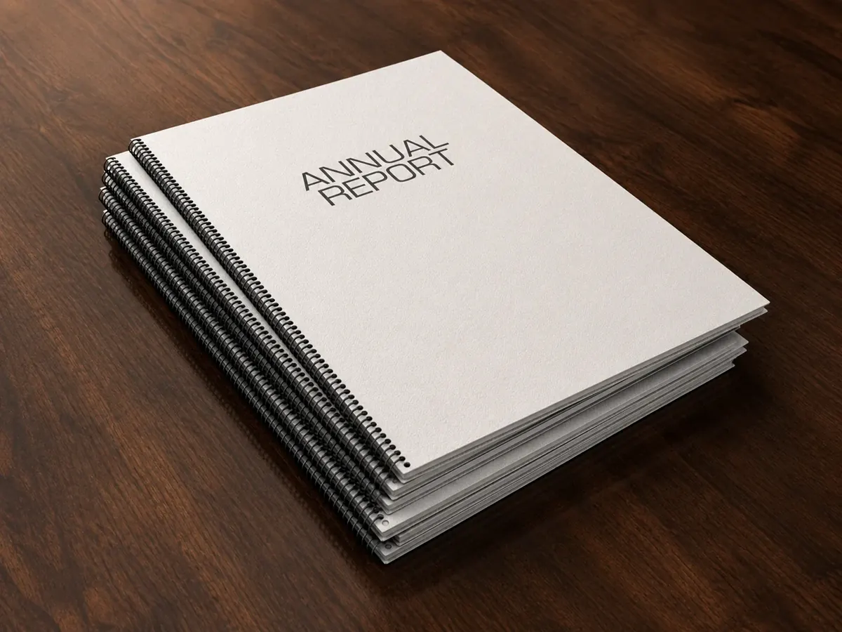 Stack of bound annual reports printed and finished in-house by City Images