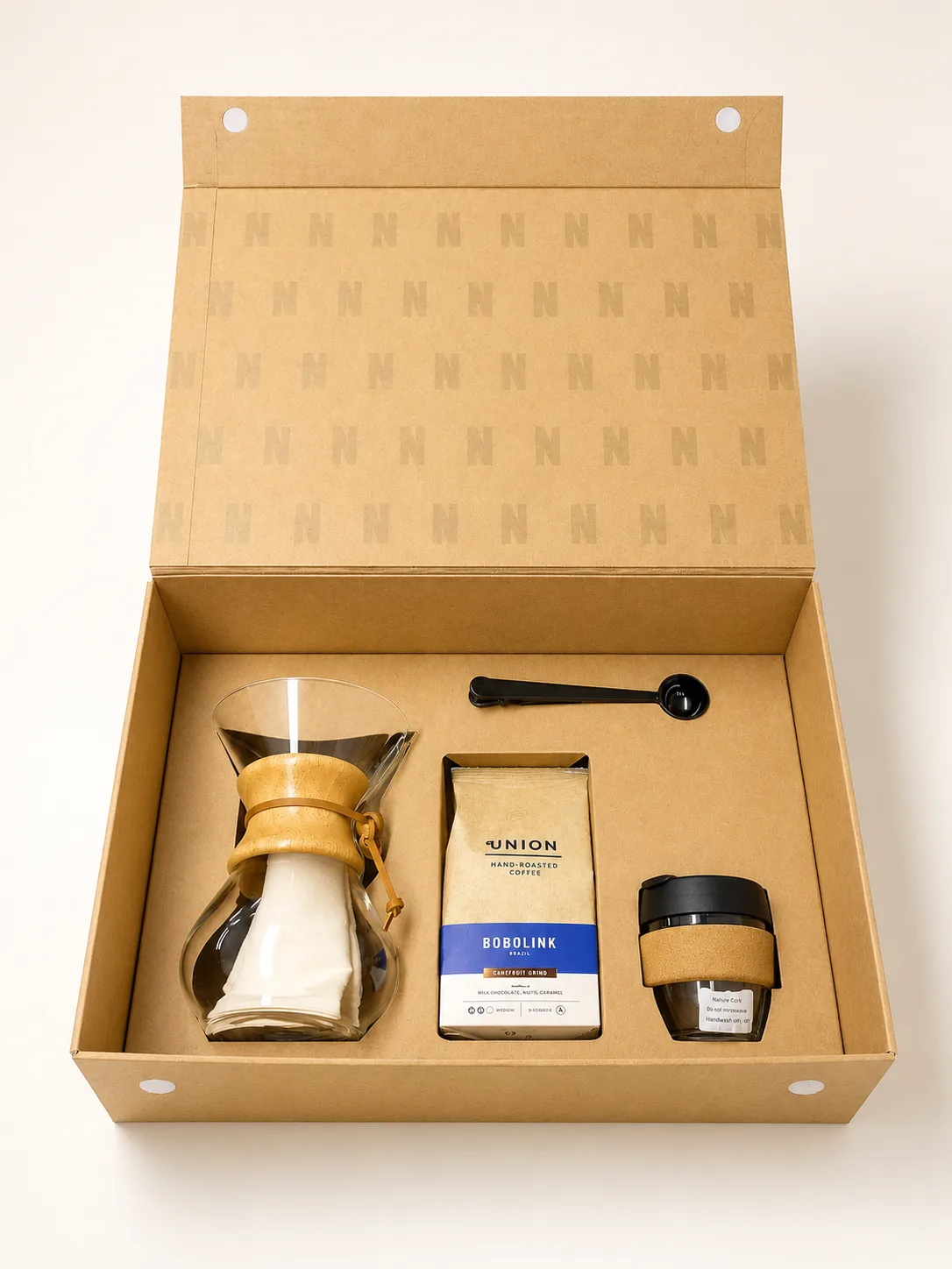 Kraft magnetic box with monogram-printed interior lid, fitted insert holding a pour-over brewer, coffee bag, scoop and cup