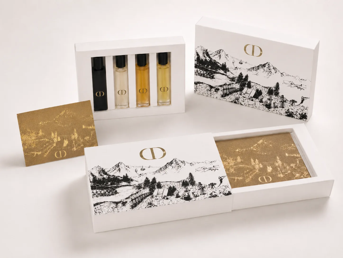 White slide-box discovery set with illustrated mountain artwork, gold foil interior panel and a fitted vial insert