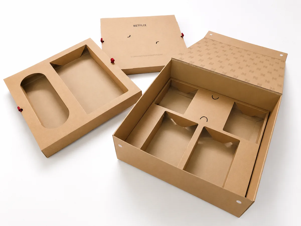 Kraft drawer box and compartment tray set CNC cut from board, shown open across a white surface