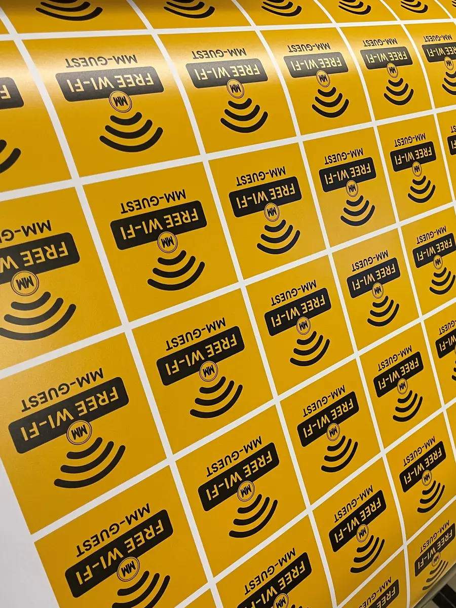 Kiss-cut vinyl stickers coming off the wide-format printer on the City Images print floor in London