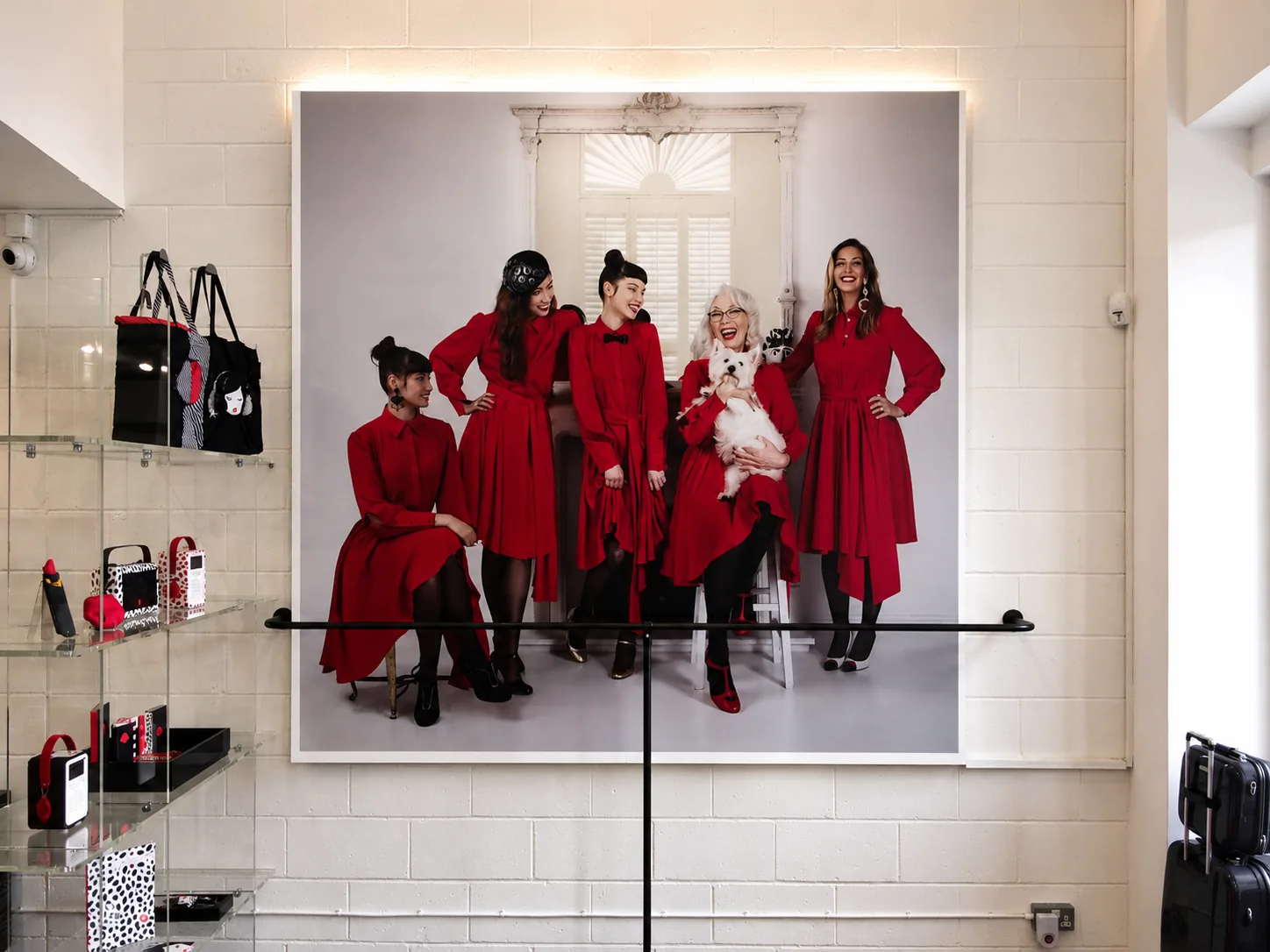 Large fashion poster install in a Mayfair boutique interior, printed by City Images