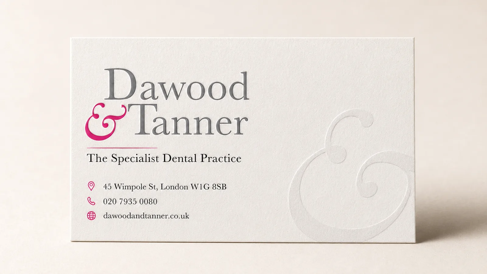 Bespoke pink letterpress business card for a Wimpole Street dental practice designed in-house at City Images
