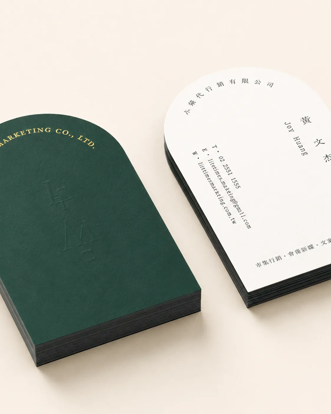 Arched die-cut cards in dark green and white with blind-deboss monogram on 450gsm cotton, City Images Camden finishing