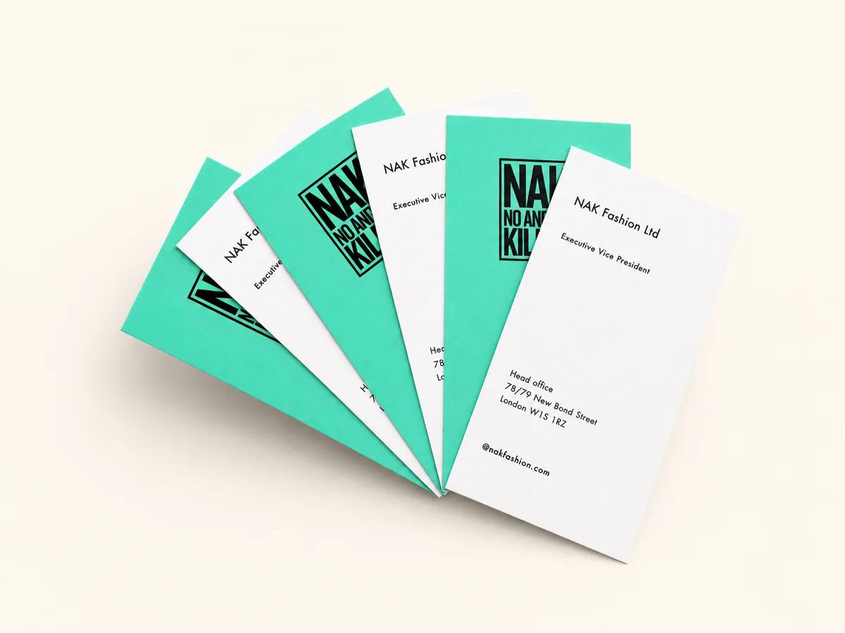 Fanned stack of five business cards in alternating teal Colorplan and white uncoated stock showing the range