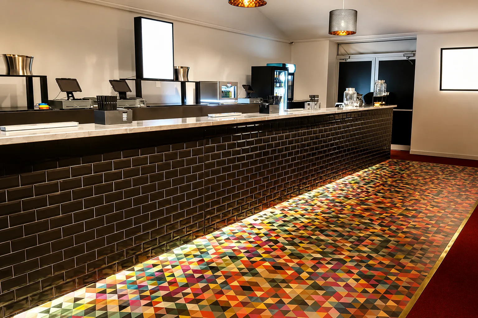 Bar with rainbow geometric floor graphic glowing under-counter
