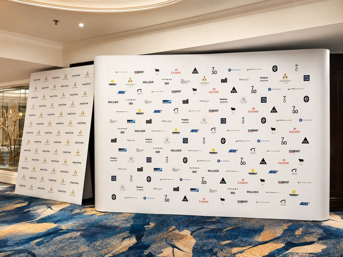 British Arrows step-and-repeat curved pop-up banner and board printed by City Images at a central London hotel event venue