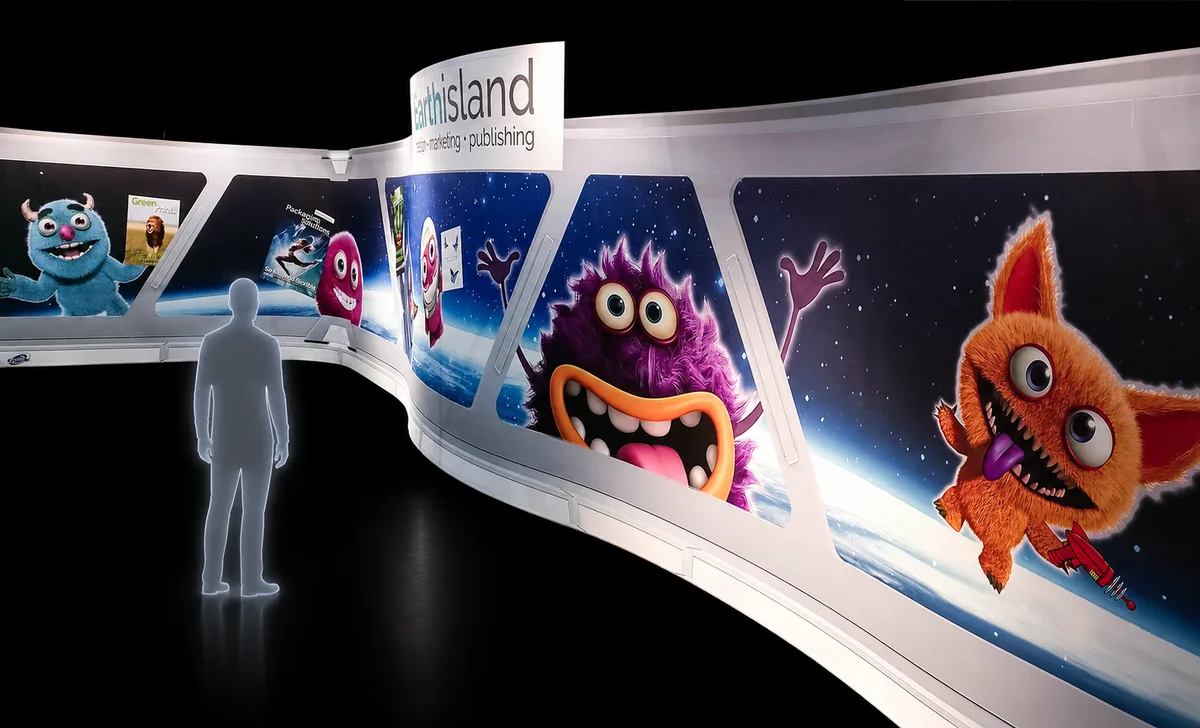 thisisland curved exhibition stand with monster character graphics, printed by City Images