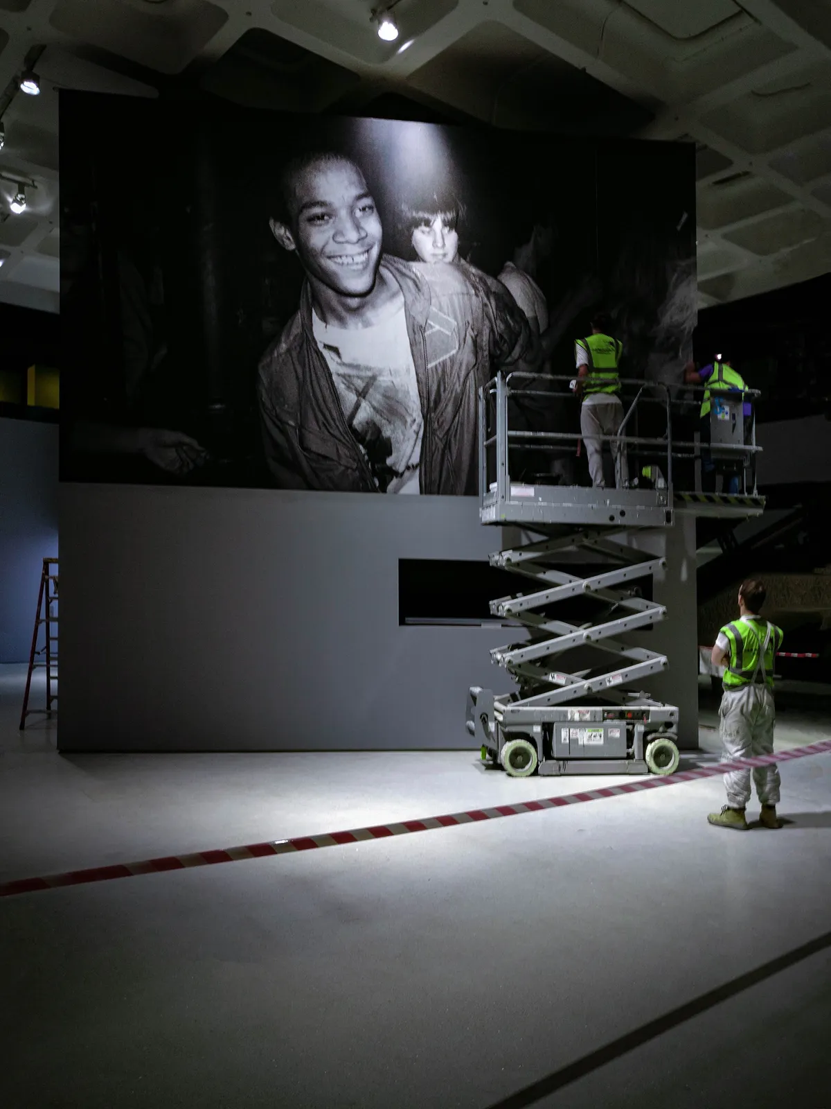 Installation team fitting large format graphics