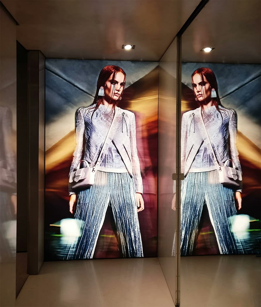 Tension fabric lightbox printed and installed in a mirrored London retail corridor